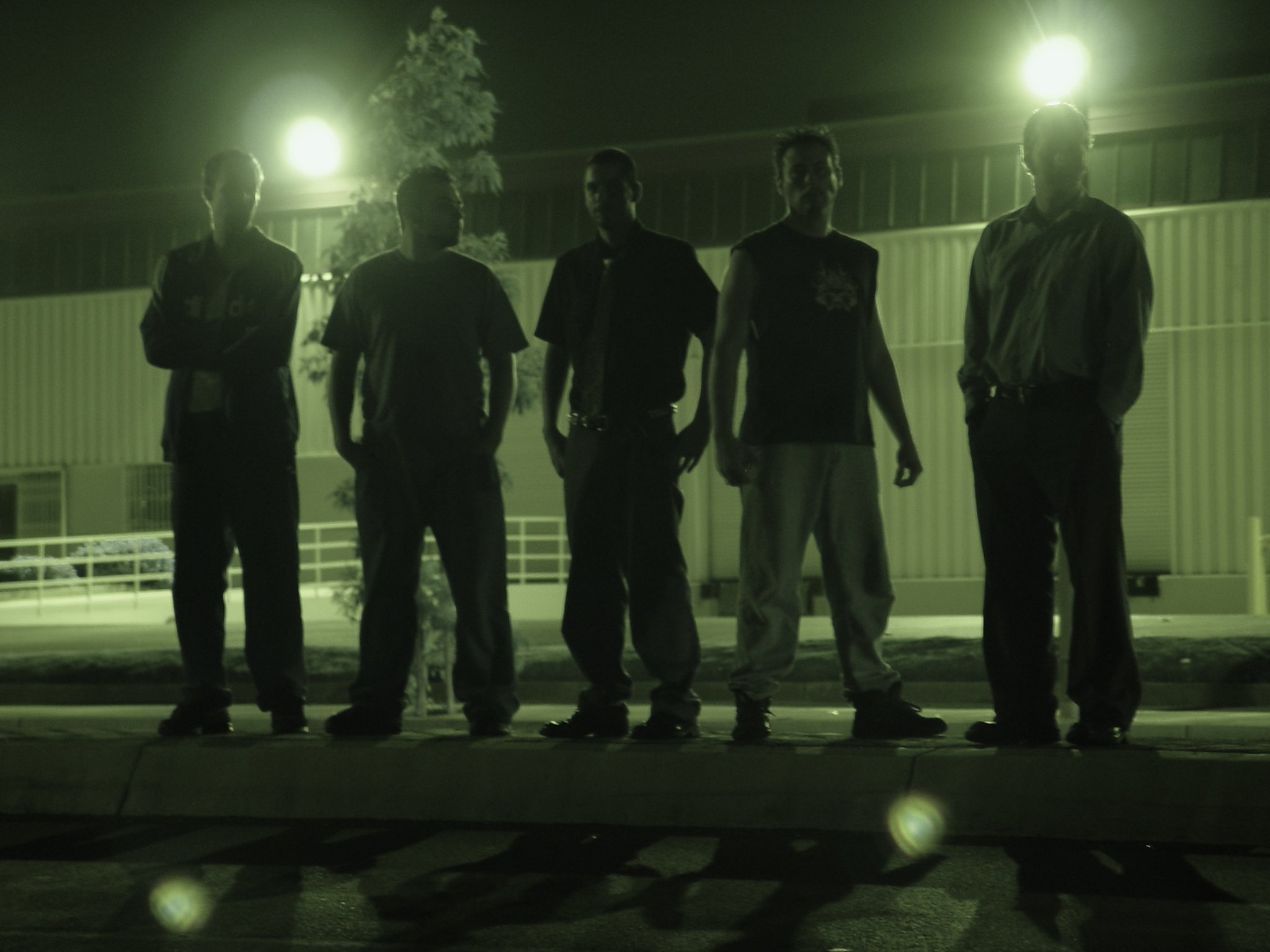 Five-piece band — night industrial shot